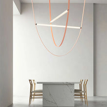 Load image into Gallery viewer, Parabola Belt Pendant | INSPIRA LIFESTYLES - Modern Minimalist Belt Pendant Lamp for high ceilings, Glass Tube Pendant Light, Creative LED Lighting Fixture, Living Room Pendant Light, Duplex Villa Pendant Lamp, Staircase Lighting Pendant, Minimalist Glass Tube Lamp, Contemporary LED Pendant Light, Elegant Belt Pendant Lamp, Stylish Modern Lighting, High-End Glass Pendant Light, Modern Living Room Illumination, Chic Duplex Villa Lamp, leather pendant light, industrial modern lighting