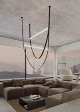 Load image into Gallery viewer, Parabola Belt Pendant | INSPIRA LIFESTYLES - Modern Minimalist Belt Pendant Lamp for high ceilings, Glass Tube Pendant Light, Creative LED Lighting Fixture, Living Room Pendant Light, Duplex Villa Pendant Lamp, Staircase Lighting Pendant, Minimalist Glass Tube Lamp, Contemporary LED Pendant Light, Elegant Belt Pendant Lamp, Stylish Modern Lighting, High-End Glass Pendant Light, Modern Living Room Illumination, Chic Duplex Villa Lamp, leather pendant light, industrial modern lighting