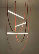 Load image into Gallery viewer, Parabola Belt Pendant | INSPIRA LIFESTYLES - Modern Minimalist Belt Pendant Lamp for high ceilings, Glass Tube Pendant Light, Creative LED Lighting Fixture, Living Room Pendant Light, Duplex Villa Pendant Lamp, Staircase Lighting Pendant, Minimalist Glass Tube Lamp, Contemporary LED Pendant Light, Elegant Belt Pendant Lamp, Stylish Modern Lighting, High-End Glass Pendant Light, Modern Living Room Illumination, Chic Duplex Villa Lamp, leather pendant light, industrial modern lighting