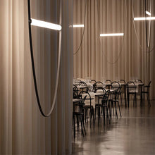 Load image into Gallery viewer, Parabola Belt Pendant | INSPIRA LIFESTYLES - Modern Minimalist Belt Pendant Lamp for high ceilings, Glass Tube Pendant Light, Creative LED Lighting Fixture, Living Room Pendant Light, Duplex Villa Pendant Lamp, Staircase Lighting Pendant, Minimalist Glass Tube Lamp, Contemporary LED Pendant Light, Elegant Belt Pendant Lamp, Stylish Modern Lighting, High-End Glass Pendant Light, Modern Living Room Illumination, Chic Duplex Villa Lamp, leather pendant light, industrial modern lighting
