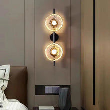 Load image into Gallery viewer, Inspira Lifestyles | Siro Wall Sconce with organic textured glass mounted on a brushed metal base. Modern sculptural wall lamp light fixture for residential or commercial interiors