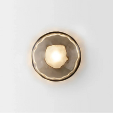 Load image into Gallery viewer, Inspira Lifestyles | Siro Wall Sconce with organic textured glass mounted on a brushed metal base. Modern sculptural wall lamp light fixture for residential or commercial interiors