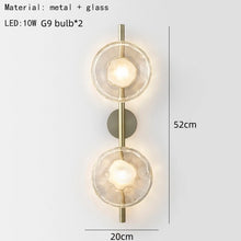 Load image into Gallery viewer, Inspira Lifestyles | Siro Wall Sconce with organic textured glass mounted on a brushed metal base. Modern sculptural wall lamp light fixture for residential or commercial interiors
