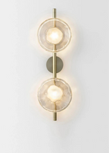 Load image into Gallery viewer, Inspira Lifestyles | Siro Wall Sconce with organic textured glass mounted on a brushed metal base. Modern sculptural wall lamp light fixture for residential or commercial interiors