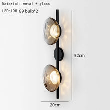 Load image into Gallery viewer, Inspira Lifestyles | Siro Wall Sconce with organic textured glass mounted on a brushed metal base. Modern sculptural wall lamp light fixture for residential or commercial interiors