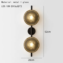 Load image into Gallery viewer, Inspira Lifestyles | Siro Wall Sconce with organic textured glass mounted on a brushed metal base. Modern sculptural wall lamp light fixture for residential or commercial interiors