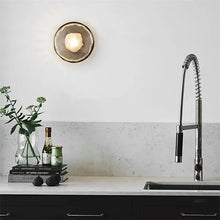 Load image into Gallery viewer, Inspira Lifestyles | Siro Wall Sconce with organic textured glass mounted on a brushed metal base. Modern sculptural wall lamp light fixture for residential or commercial interiors