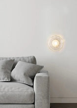 Load image into Gallery viewer, Inspira Lifestyles | Siro Wall Sconce with organic textured glass mounted on a brushed metal base. Modern sculptural wall lamp light fixture for residential or commercial interiors