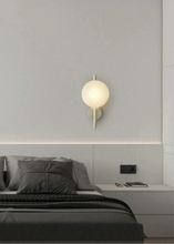 Load image into Gallery viewer, Inspira Lifestyles | Siro Wall Sconce with organic textured glass mounted on a brushed metal base. Modern sculptural wall lamp light fixture for residential or commercial interiors