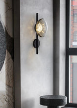 Load image into Gallery viewer, Inspira Lifestyles | Siro Wall Sconce with organic textured glass mounted on a brushed metal base. Modern sculptural wall lamp light fixture for residential or commercial interiors