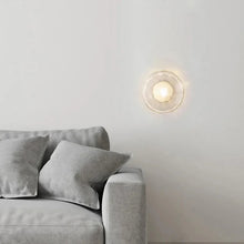 Load image into Gallery viewer, Inspira Lifestyles | Siro Wall Sconce with organic textured glass mounted on a brushed metal base. Modern sculptural wall lamp light fixture for residential or commercial interiors