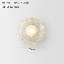 Load image into Gallery viewer, Inspira Lifestyles | Siro Wall Sconce with organic textured glass mounted on a brushed metal base. Modern sculptural wall lamp light fixture for residential or commercial interiors