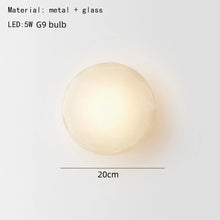 Load image into Gallery viewer, Inspira Lifestyles | Siro Wall Sconce with organic textured glass mounted on a brushed metal base. Modern sculptural wall lamp light fixture for residential or commercial interiors