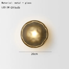 Load image into Gallery viewer, Inspira Lifestyles | Siro Wall Sconce with organic textured glass mounted on a brushed metal base. Modern sculptural wall lamp light fixture for residential or commercial interiors