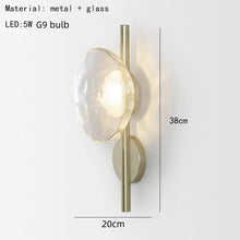 Load image into Gallery viewer, Inspira Lifestyles | Siro Wall Sconce with organic textured glass mounted on a brushed metal base. Modern sculptural wall lamp light fixture for residential or commercial interiors