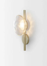 Load image into Gallery viewer, Inspira Lifestyles | Siro Wall Sconce with organic textured glass mounted on a brushed metal base. Modern sculptural wall lamp light fixture for residential or commercial interiors