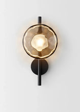 Load image into Gallery viewer, Inspira Lifestyles | Siro Wall Sconce with organic textured glass mounted on a brushed metal base. Modern sculptural wall lamp light fixture for residential or commercial interiors