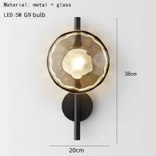 Load image into Gallery viewer, Inspira Lifestyles | Siro Wall Sconce with organic textured glass mounted on a brushed metal base. Modern sculptural wall lamp light fixture for residential or commercial interiors