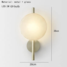 Load image into Gallery viewer, Inspira Lifestyles | Siro Wall Sconce with organic textured glass mounted on a brushed metal base. Modern sculptural wall lamp light fixture for residential or commercial interiors