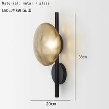 Load image into Gallery viewer, Inspira Lifestyles | Siro Wall Sconce with organic textured glass mounted on a brushed metal base. Modern sculptural wall lamp light fixture for residential or commercial interiors