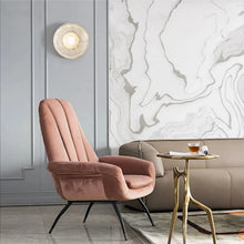 Load image into Gallery viewer, Inspira Lifestyles | Siro Wall Sconce with organic textured glass mounted on a brushed metal base. Modern sculptural wall lamp light fixture for residential or commercial interiors