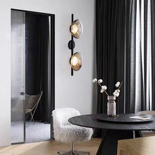 Load image into Gallery viewer, Inspira Lifestyles | Siro Wall Sconce with organic textured glass mounted on a brushed metal base. Modern sculptural wall lamp light fixture for residential or commercial interiors