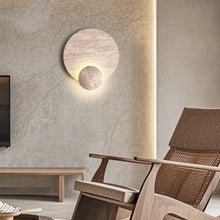 Load image into Gallery viewer, Inspira Lifestyles | Solace Travertine Wall Light – A natural travertine wall sconce designed to bring warmth, organic texture, and ambient lighting to contemporary interior spaces. Ideal as accent lighting in living rooms, bathrooms, stairwells, spas, and wellness-inspired environments. Natural stone wall lighting for both residential and commercial interiors.