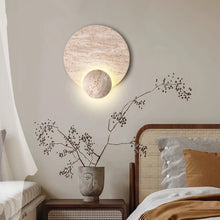 Load image into Gallery viewer, Inspira Lifestyles | Solace Travertine Wall Light – A natural travertine wall sconce designed to bring warmth, organic texture, and ambient lighting to contemporary interior spaces. Ideal as accent lighting in living rooms, bathrooms, stairwells, spas, and wellness-inspired environments. Natural stone wall lighting for both residential and commercial interiors.