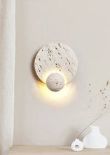 Load image into Gallery viewer, Inspira Lifestyles | Solace Travertine Wall Light – A natural travertine wall sconce designed to bring warmth, organic texture, and ambient lighting to contemporary interior spaces. Ideal as accent lighting in living rooms, bathrooms, stairwells, spas, and wellness-inspired environments. Natural stone wall lighting for both residential and commercial interiors.