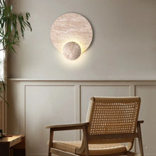 Load image into Gallery viewer, Inspira Lifestyles | Solace Travertine Wall Light – A natural travertine wall sconce designed to bring warmth, organic texture, and ambient lighting to contemporary interior spaces. Ideal as accent lighting in living rooms, bathrooms, stairwells, spas, and wellness-inspired environments. Natural stone wall lighting for both residential and commercial interiors.