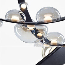 Load image into Gallery viewer, INSPIRA LIFESTYLES - Strapped Chandelier - ABSTRACT LIGHT, ACCENT LIGHT, BEDROOM LIGHT, BOARDROOM LIGHT, CHANDELIER, DINING LIGHT, FEATURE LIGHT, GLASS GLOBE CHANDELIER, GLOBE CHANDELIER, GLOBE LIGHT, HANGING LIGHT, HOTEL LIGHT, LEATHER STRAP LIGHT, LED CHANDELIER, LED LIGHT, LIGHT, LIGHT FIXTURE, LIGHTING, LIGHTS, LIVING ROOM LIGHT, MINIMAL LIGHT FIXTURE, MINIMALIST CHANDELIER, MINIMALIST LIGHT, MODERN CHANDELIER, MODERN LIGHT, MODERN PENDANT LIGHT, PENDANT LIGHT, RESTAURANT LIGHT, SCULPTURAL LIGHT