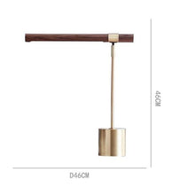 Load image into Gallery viewer, INSPIRA LIFESTYLES – Postaro Table Lamp – modern LED table lamp with postmodern design, featuring a dark wood base and satin brass accents. Sculptural yet functional lighting with a 90-degree adjustable tilt, perfect for bedside tables, home offices, and contemporary workspaces.
