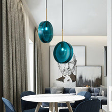 Load image into Gallery viewer, INSPIRA LIFESTYLES - Azura Blue Glass Pendant featuring translucent circular blue glass, modern sculptural pendant lighting with minimalist architectural design, ambient blue glass pendant for dining rooms, kitchen islands, bedrooms, living rooms, entryways, restaurants, boutique hotels, and luxury contemporary interiors
