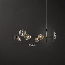 Load image into Gallery viewer, INSPIRA LIFESTYLES - Bubbles Linear Chandelier - ABSTRACT LIGHT, ACCENT LIGHT, BUBBLE CHANDELIER, CHANDELIER, GLASS GLOBE CHANDELIER, GLOBE CHANDELIER, LED CHANDELIER, LED PENDANT, LIGHT, LIGHT FIXTURE, LIGHTING, LIGHTS, MODERN CHANDELIER, MODERN PENDANT, PENDANT LIGHT, SCULPTURAL LIGHT