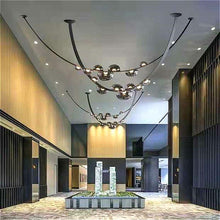 Load image into Gallery viewer, INSPIRA LIFESTYLES - Strapped Chandelier - ABSTRACT LIGHT, ACCENT LIGHT, BEDROOM LIGHT, BOARDROOM LIGHT, CHANDELIER, DINING LIGHT, FEATURE LIGHT, GLASS GLOBE CHANDELIER, GLOBE CHANDELIER, GLOBE LIGHT, HANGING LIGHT, HOTEL LIGHT, LEATHER STRAP LIGHT, LED CHANDELIER, LED LIGHT, LIGHT, LIGHT FIXTURE, LIGHTING, LIGHTS, LIVING ROOM LIGHT, MINIMAL LIGHT FIXTURE, MINIMALIST CHANDELIER, MINIMALIST LIGHT, MODERN CHANDELIER, MODERN LIGHT, MODERN PENDANT LIGHT, PENDANT LIGHT, RESTAURANT LIGHT, SCULPTURAL LIGHT