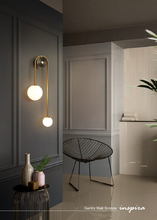 Load image into Gallery viewer, INSPIRA LIFESTYLES - Gentry Wall Sconce, postmodern dual globe wall light, frosted glass wall sconce, contemporary bedside wall lighting, sculptural architectural wall lamp, luxury modern wall light in brass finish
