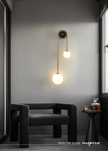 Load image into Gallery viewer, INSPIRA LIFESTYLES - Gentry Wall Sconce, postmodern dual globe wall light, frosted glass wall sconce, contemporary bedside wall lighting, sculptural architectural wall lamp, luxury modern wall light in brass finish
