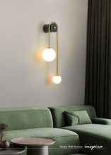 Load image into Gallery viewer, INSPIRA LIFESTYLES - Gentry Wall Sconce, postmodern dual globe wall light, frosted glass wall sconce, contemporary bedside wall lighting, sculptural architectural wall lamp, luxury modern wall light in brass finish
