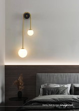 Load image into Gallery viewer, INSPIRA LIFESTYLES - Gentry Wall Sconce, postmodern dual globe wall light, frosted glass wall sconce, contemporary bedside wall lighting, sculptural architectural wall lamp, luxury modern wall light in brass finish
