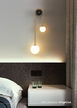 Load image into Gallery viewer, INSPIRA LIFESTYLES - Gentry Wall Sconce, postmodern dual globe wall light, frosted glass wall sconce, contemporary bedside wall lighting, sculptural architectural wall lamp, luxury modern wall light in brass finish
