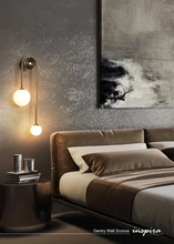 Load image into Gallery viewer, INSPIRA LIFESTYLES - Gentry Wall Sconce, postmodern dual globe wall light, frosted glass wall sconce, contemporary bedside wall lighting, sculptural architectural wall lamp, luxury modern wall light in brass finish
