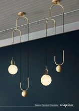 Load image into Gallery viewer, INSPIRA LIFESTYLES - Balance Pendant Chandelier, sculptural pendant light with frosted glass globe, modern bedside pendant lighting, gold and black minimalist hanging light for kitchen island, bathroom, and hospitality interiors
