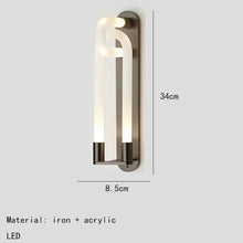 Load image into Gallery viewer, Inspira Lifestyles | Figaro Wall Sconce – Sculptural LED wall light with interlocking link design in brushed gold or matte black for modern and classic interiors
