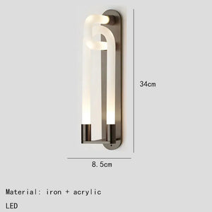 Inspira Lifestyles | Figaro Wall Sconce – Sculptural LED wall light with interlocking link design in brushed gold or matte black for modern and classic interiors