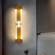 Load image into Gallery viewer, Inspira Lifestyles | Figaro Wall Sconce – Sculptural LED wall light with interlocking link design in brushed gold or matte black for modern and classic interiors
