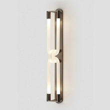Load image into Gallery viewer, Inspira Lifestyles | Figaro Wall Sconce – Sculptural LED wall light with interlocking link design in brushed gold or matte black for modern and classic interiors
