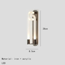 Load image into Gallery viewer, Inspira Lifestyles | Figaro Wall Sconce – Sculptural LED wall light with interlocking link design in brushed gold or matte black for modern and classic interiors
