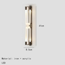 Load image into Gallery viewer, Inspira Lifestyles | Figaro Wall Sconce – Sculptural LED wall light with interlocking link design in brushed gold or matte black for modern and classic interiors
