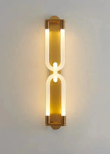 Load image into Gallery viewer, Inspira Lifestyles | Figaro Wall Sconce – Sculptural LED wall light with interlocking link design in brushed gold or matte black for modern and classic interiors
