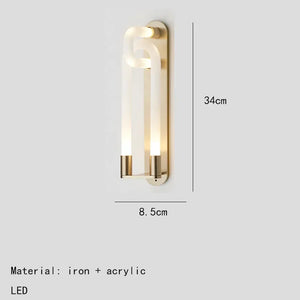 Inspira Lifestyles | Figaro Wall Sconce – Sculptural LED wall light with interlocking link design in brushed gold or matte black for modern and classic interiors